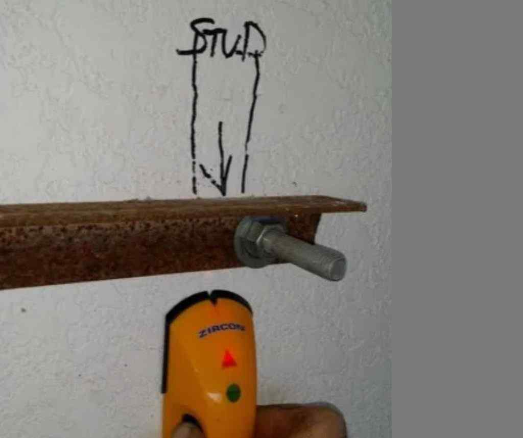 Inside the wall, a 6' angle is drilled to match bolt penetrations and tightened.