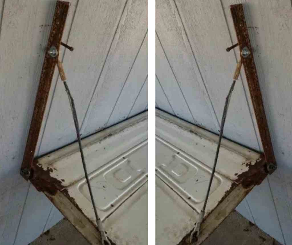 Cables connecting the wall angles to the tailgate ends to hold the bench open.