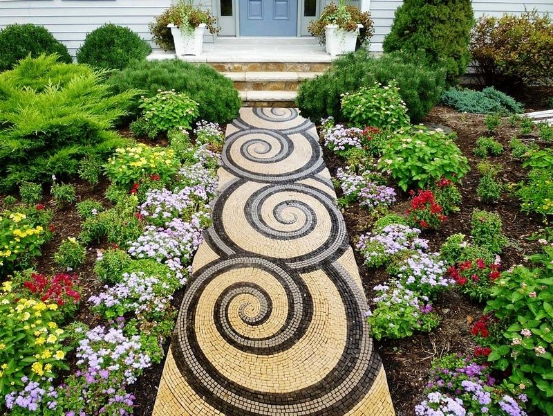 Here's another interesting example of a mosaic garden path. Mosaics are a great DIY project for those with patience.