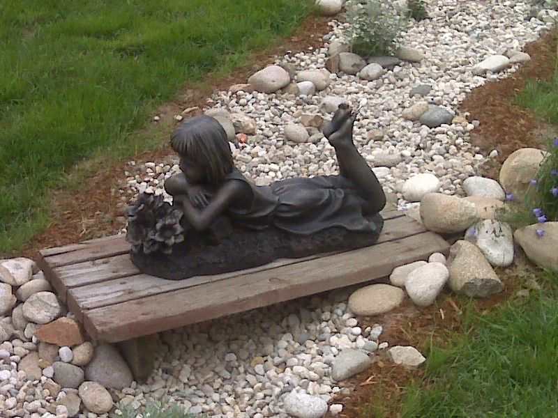 An image of a statue for dry river bed landscaping. 