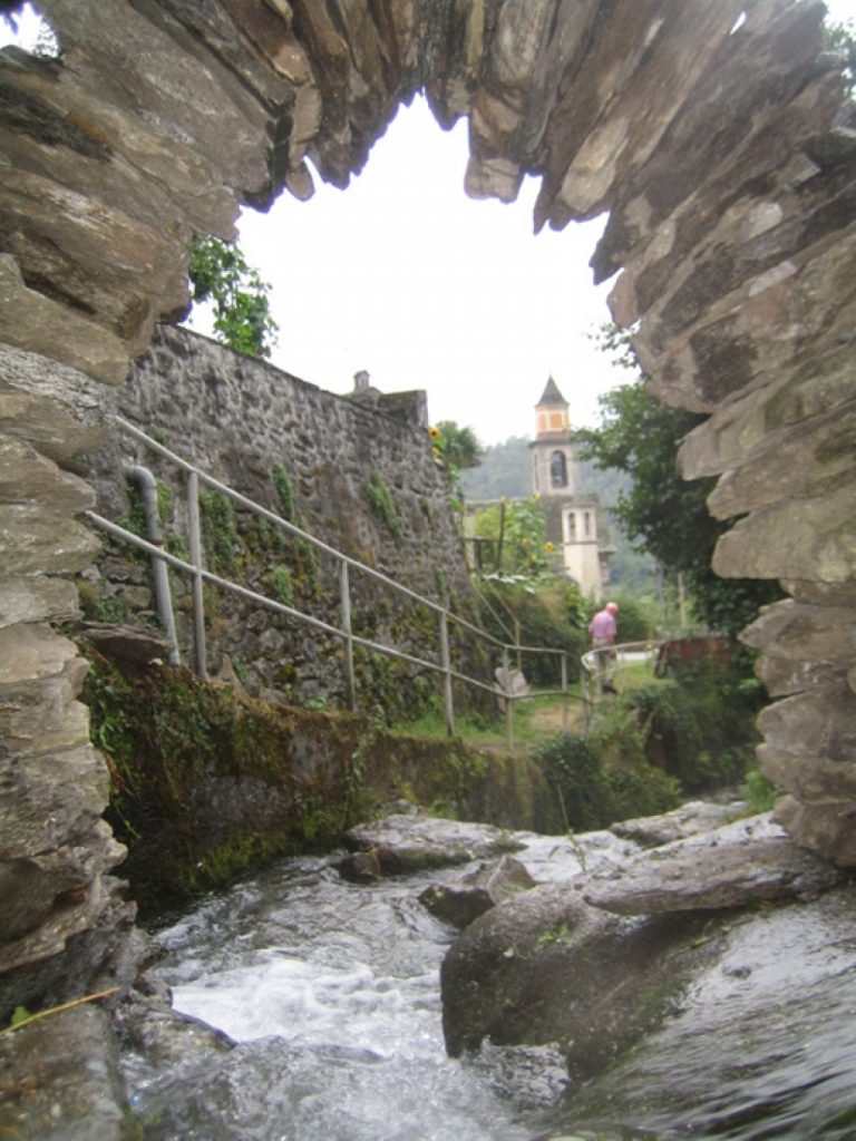 an arch over the river in Oira Domodossol Italy - Summer of Love 2010