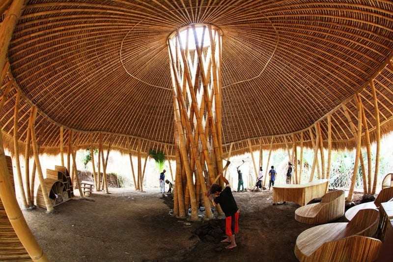 Here's another example of the extraordinary versatility of bamboo. The building will be used as a junior school.  When we came across the image it was attributed to architect Simon Velez, however the central light well is similar to another design by Jeorge Stamm.  What do you think of the gorgeous furniture!