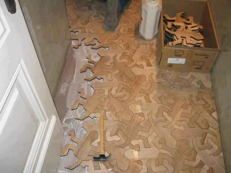 I always worry when I have to rely on a translation, but I think this Escher inspired floor was created by
