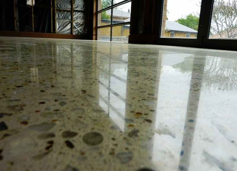 If your existing concrete floor is in good shape, consider getting it polished.