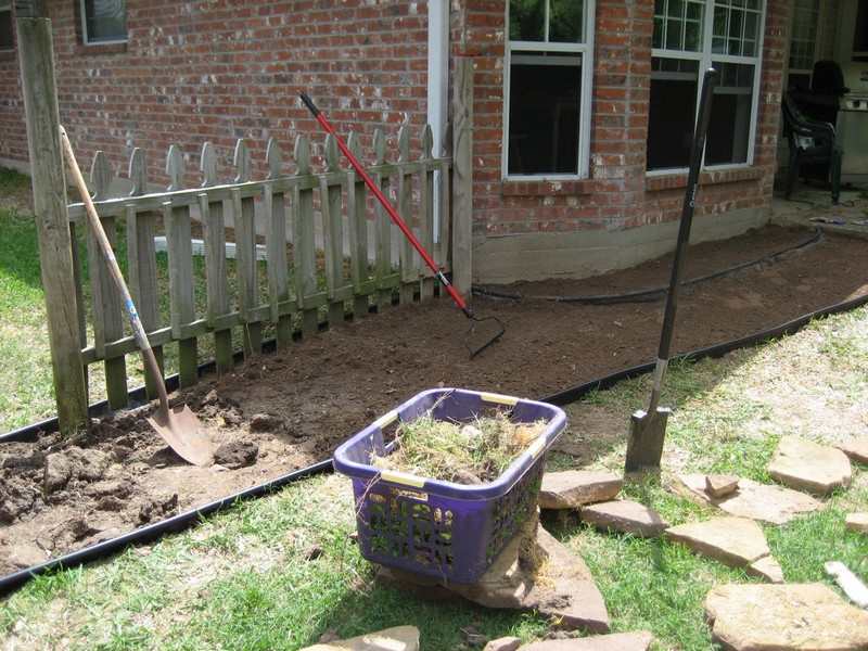 DIY Backyard Walkway - Started by moving all the rocks out