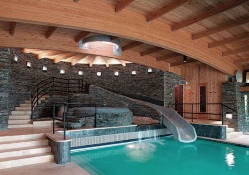 Indoor Pool Design with Cool Slide and Wooden Ceiling - Remals