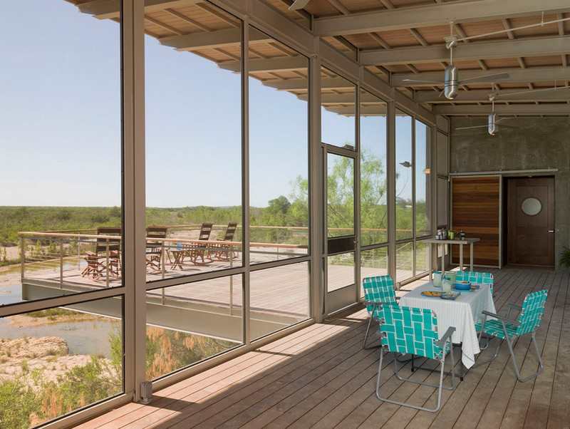 The screened deck overlooking the river
