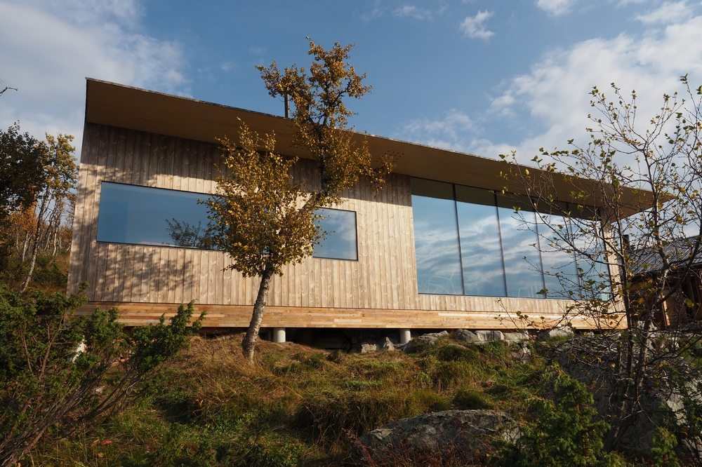 The house blends well with the surrounding landscape.