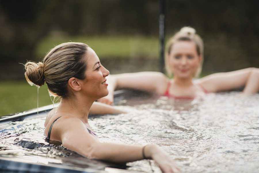 Friends relaxing in a hot tub