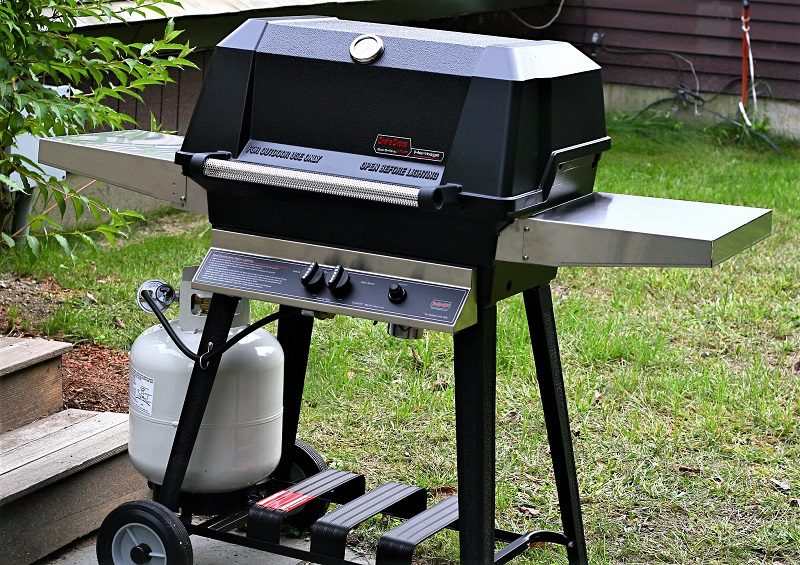 Different grill models offer different ways to secure the tank below the grill. Some grills have an open space below. Others have a built-in compartment for the tank.
