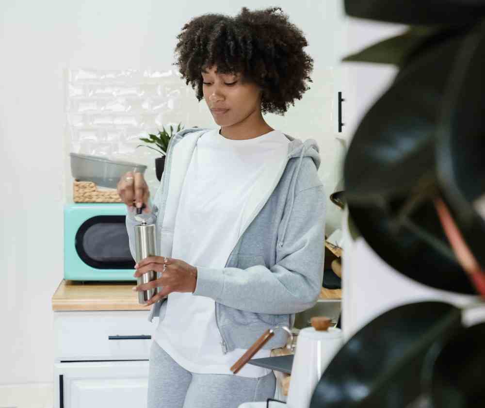 An image of a woman using a coffee bar.