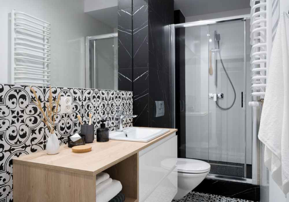 An image of a stylish small bathroom using tiles to improve its aesthetic. 