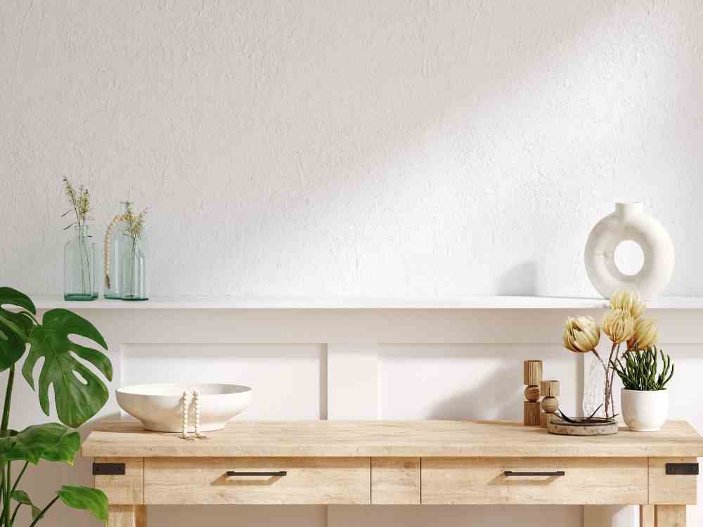 An image of a wooden table with drawers. 
