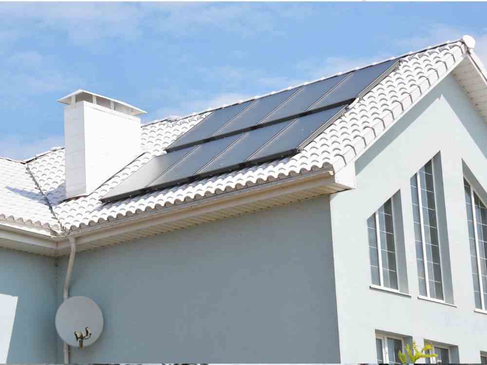 An image of solar panels on a roof. 