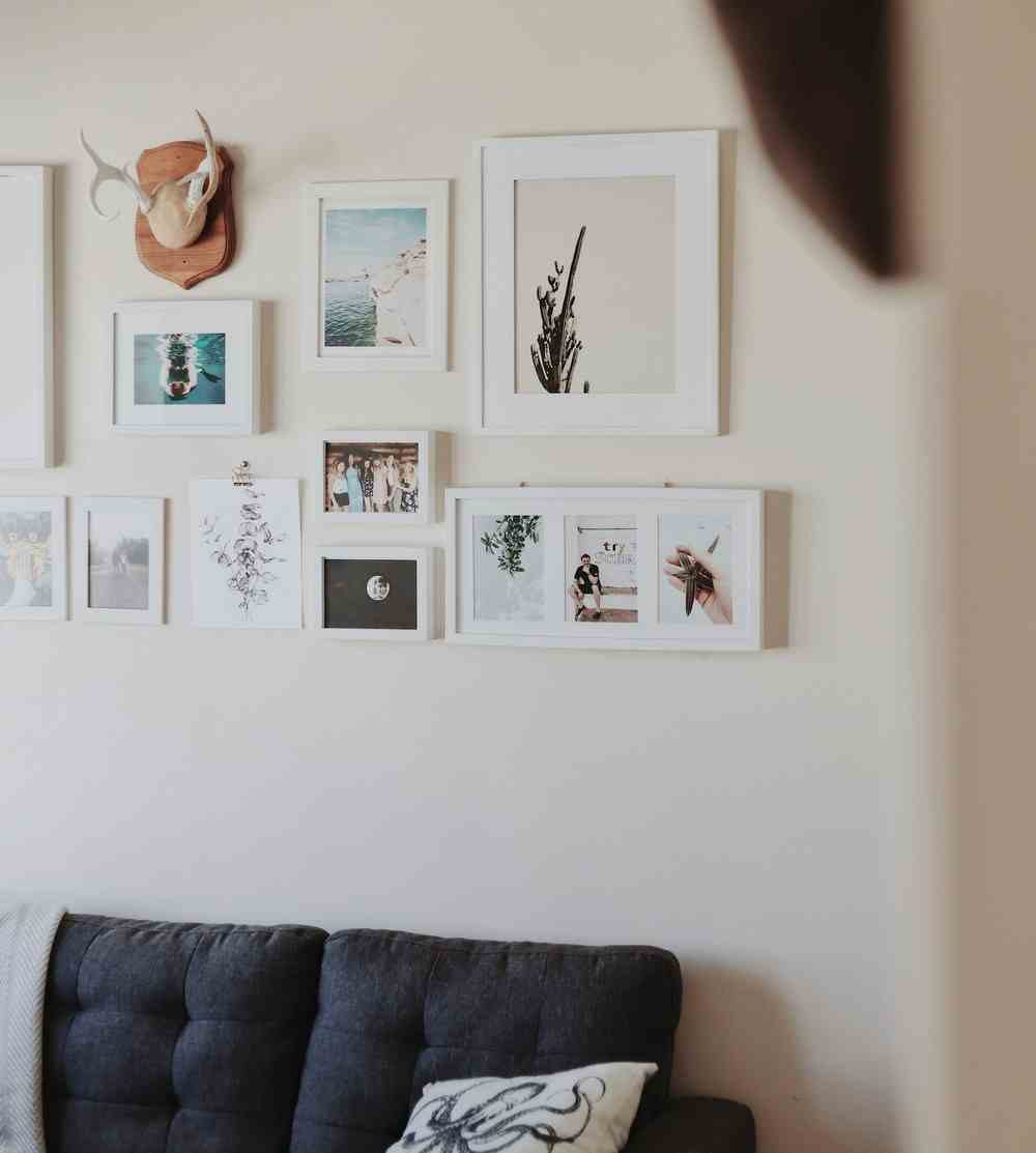 Photo of a gallery wall that shows different coastal elements.