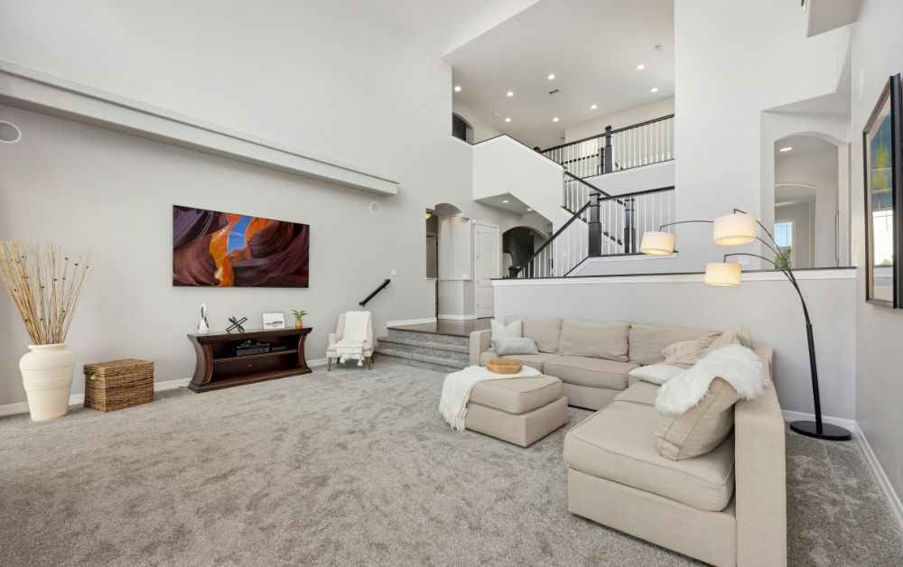 An image of a living room with plush rugs. 