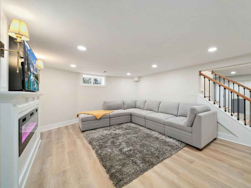 An image of a finished basement turned into an entertainment center. 