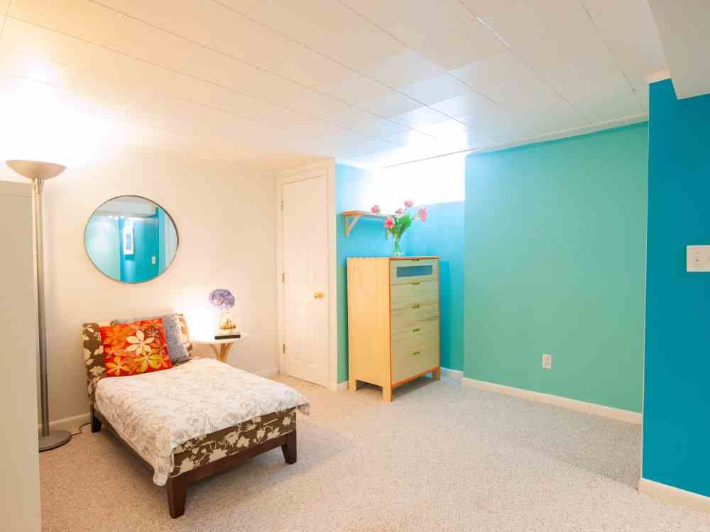 An image of a finished basement turned into an Airbnb property.