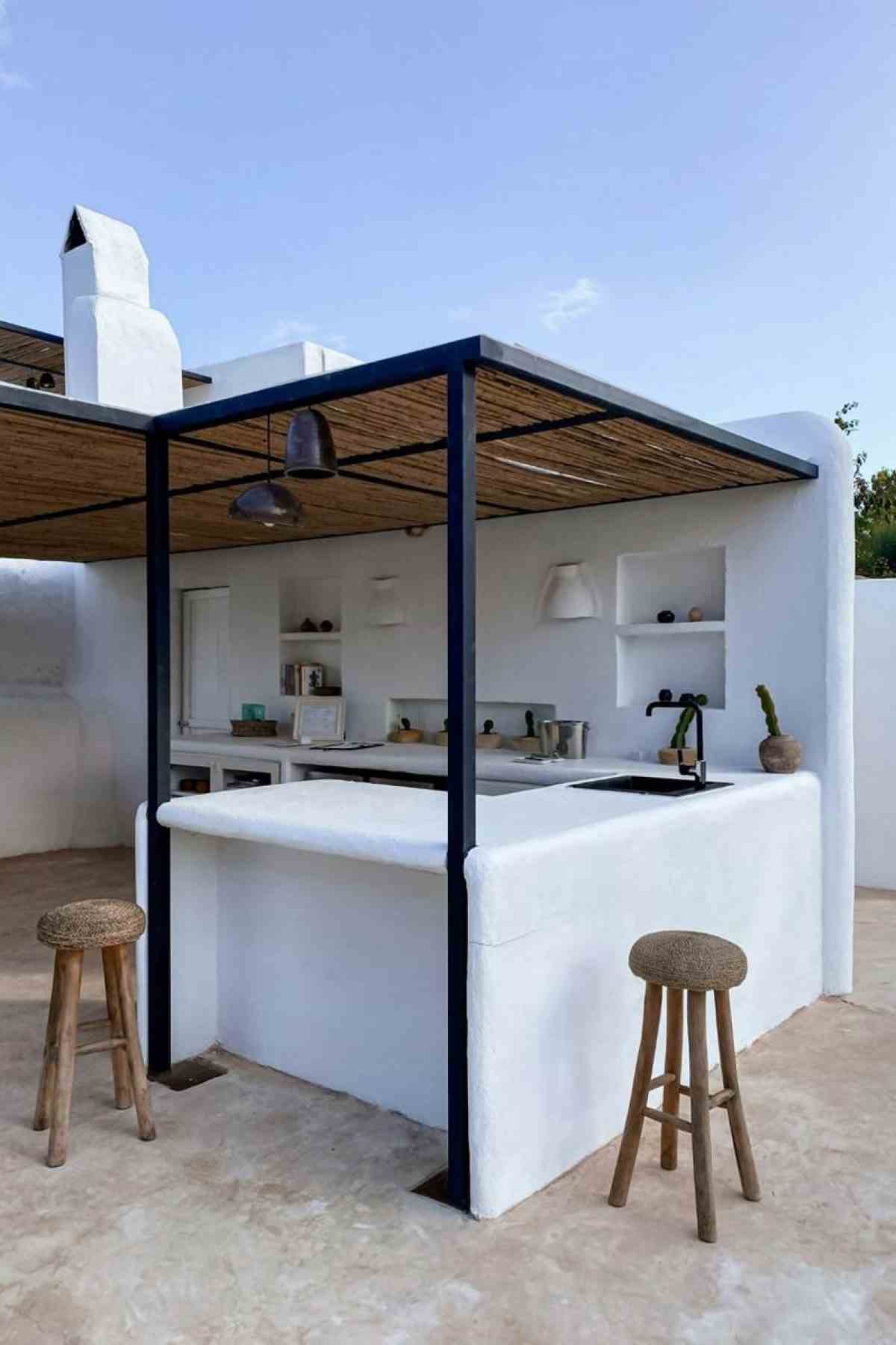 A white, rustic outdoor kichen setting