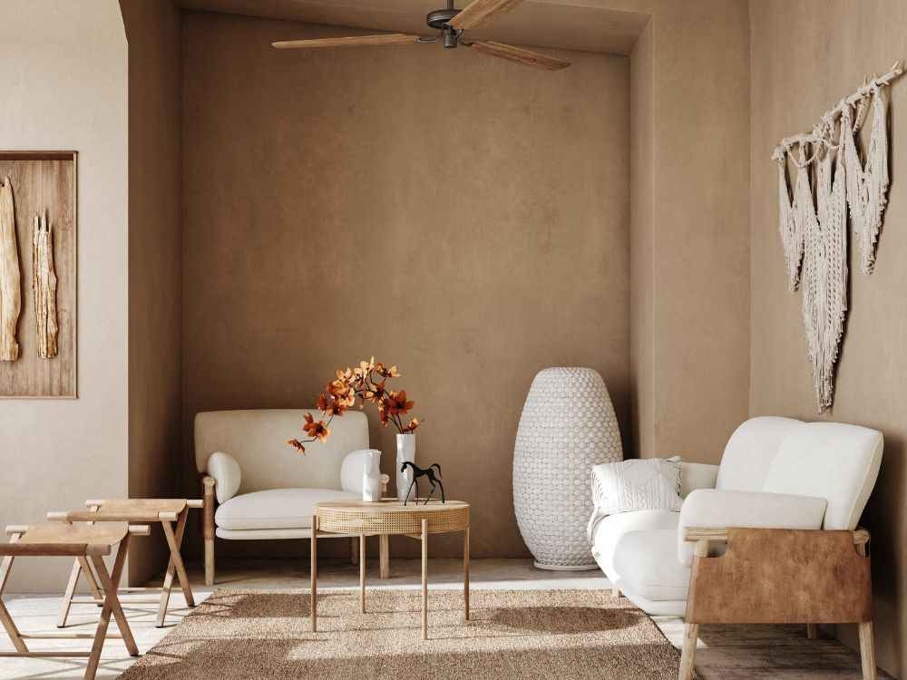 An image of furniture and other parts of an interior space with neutral colors.