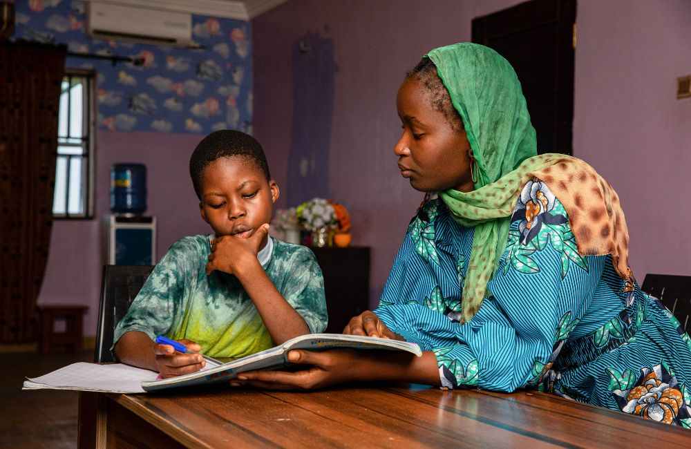 An image of parents doing homeschool programs. 