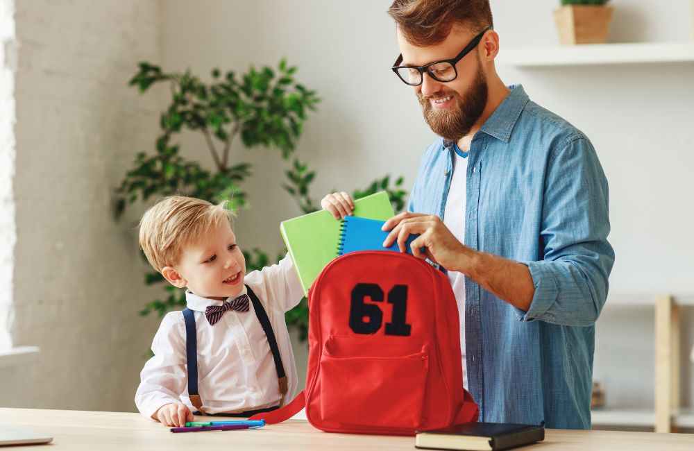 An image of a boy getting ready for school. 