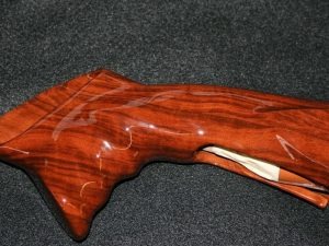 An image of a wooden guitar that went through hydro dipping.