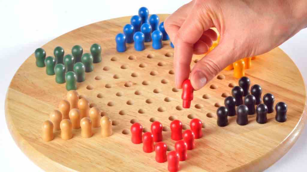 An image of a person playing Chinese checkers