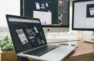 An image of a DIYer creating their website for an article about craft store websites.