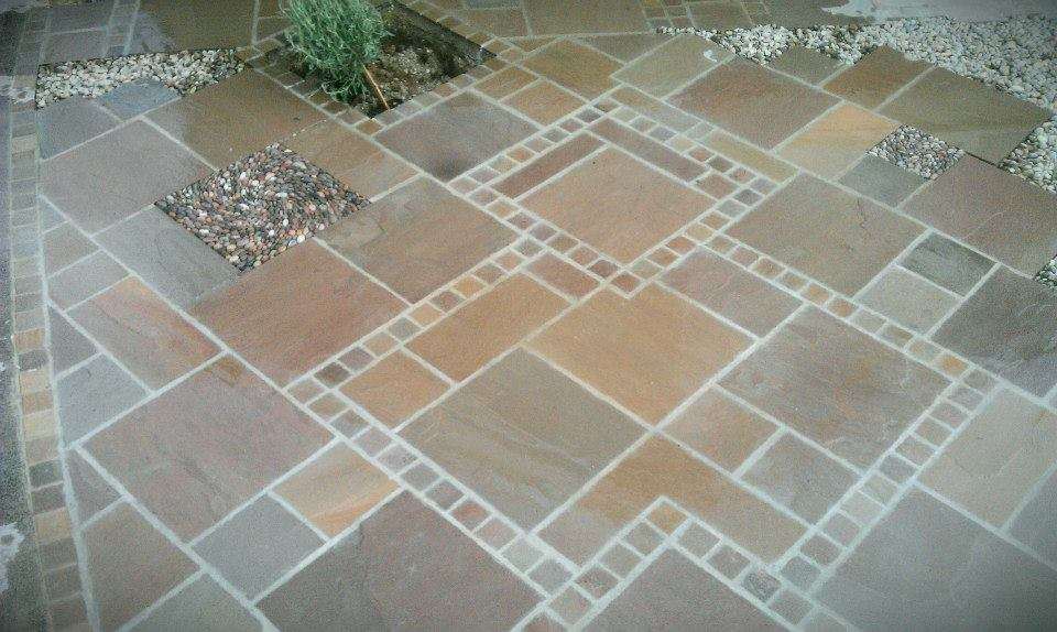 Indian sandstone paving with inset pebble mosaic 'thinking outside the box'