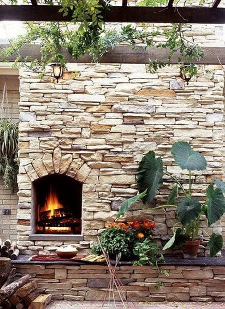 Another clever design using the dry stone building technique - this time incorporating a cozy outdoor fireplace into the garden wall.
