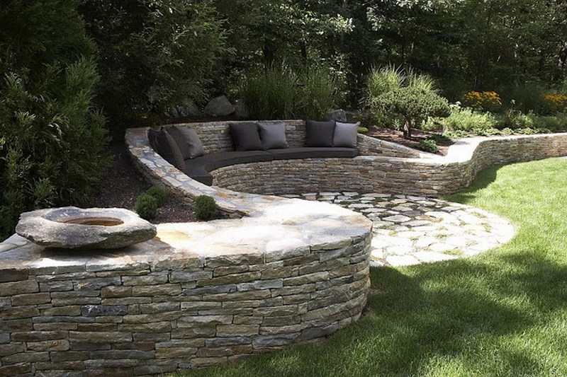 We haven’t given you any dry stone wall ideas for ages.   Here's one we think is worth sharing. It’s a great example of a retaining wall that does NOT interfere with the natural site drainage, and has a seat and cushions too!  Love it or hate it? Let us know what you think in the comments section.