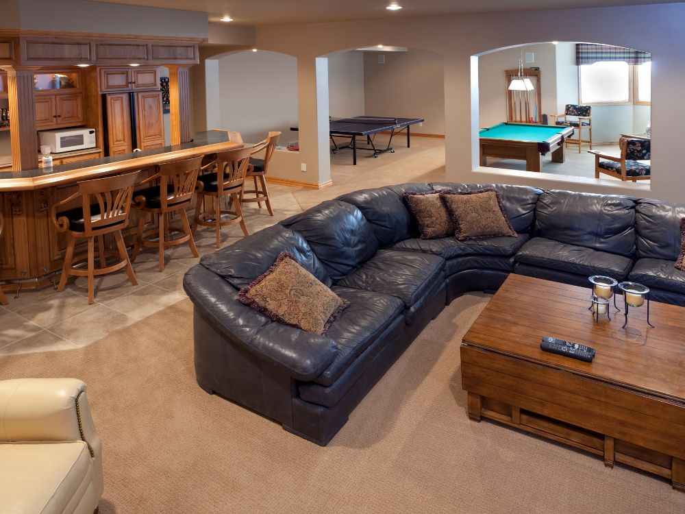 An image of a finished basement that contains a speakeasy bar.